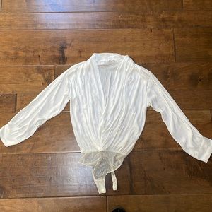 Free People white silky long sleeve bodysuit.